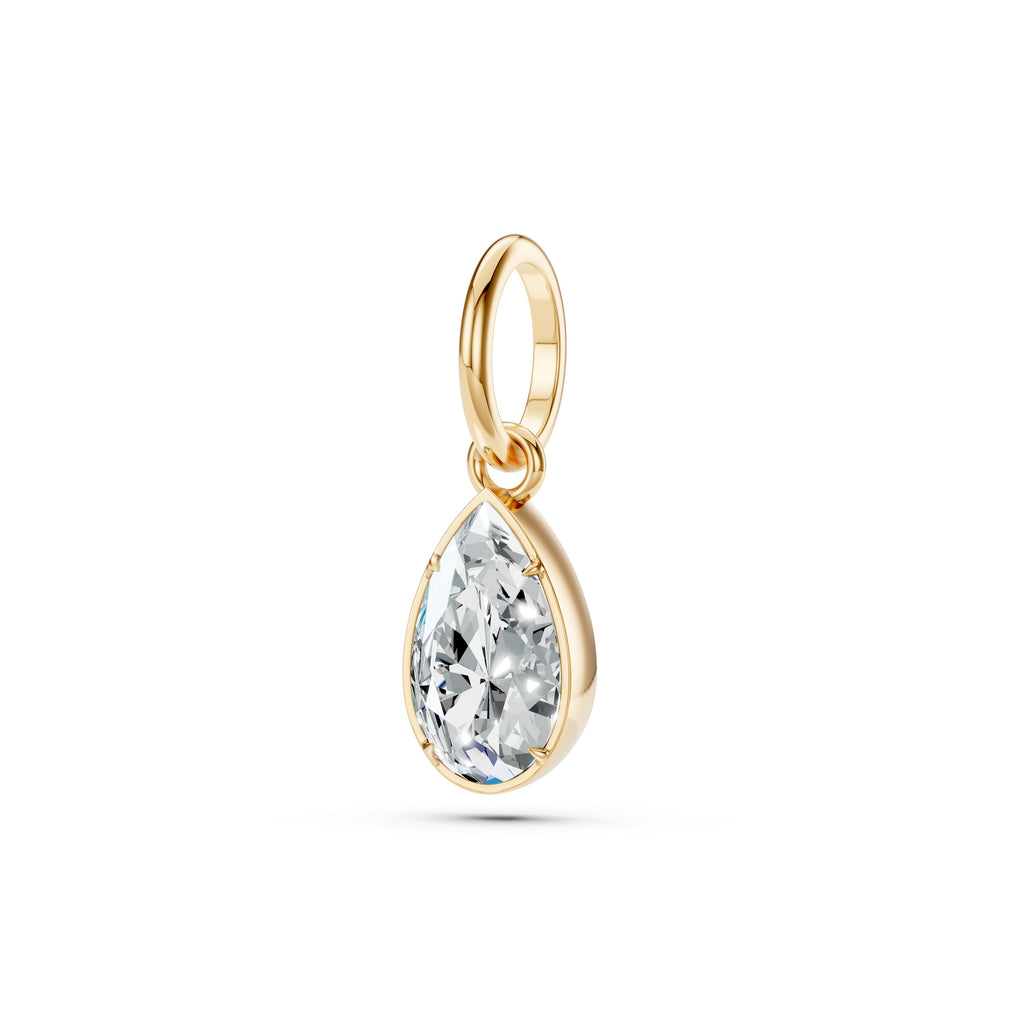 Gold pendant with a clear gemstone on a white background